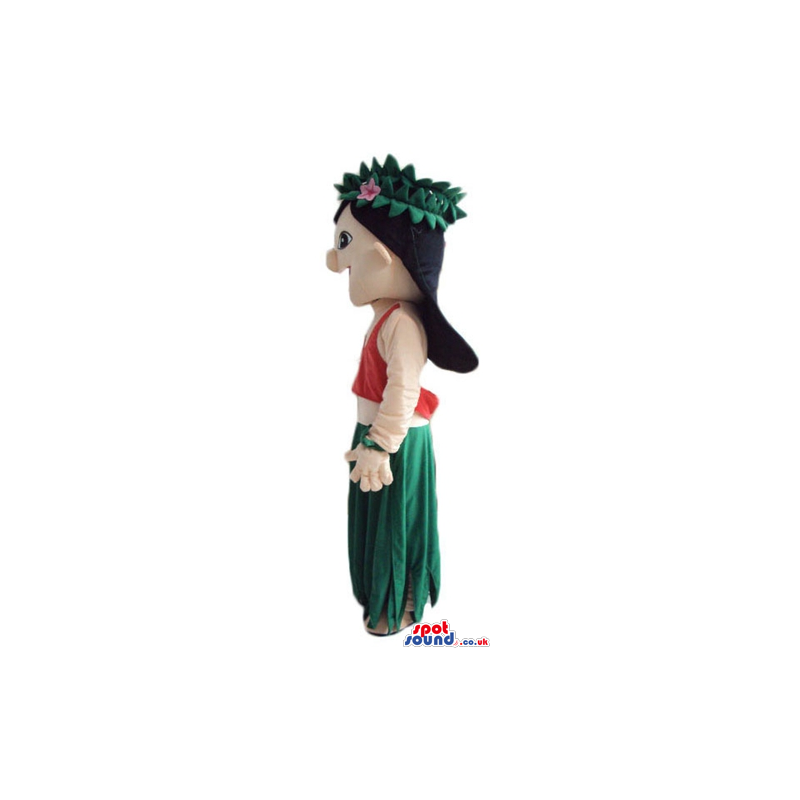 Girl with long black hair wearing a long green dress and a red