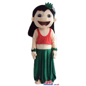 Girl with long black hair wearing a long green dress and a red