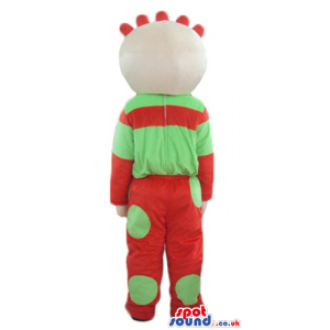 Boy wearing a red and green sweater and matching trousers -