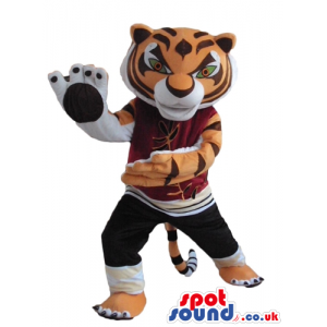 Sporty tiger wearing black trousers and a bordeaux sweater -