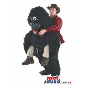 Black Gorilla Mascot With Human Walker On Top And Big Eyes -