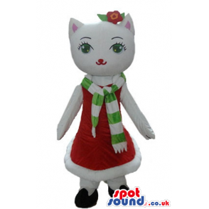 White cat wearing a long red dress and a white and green scarf