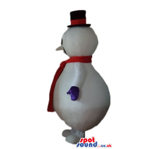 Snowman with round black eyes wearing a black tophat and a red