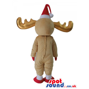 Beige deer with golden horns wearing a red santa's hat and a