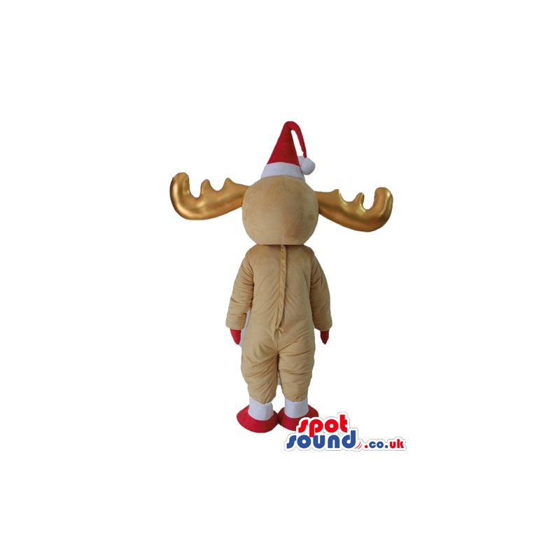Beige deer with golden horns wearing a red santa's hat and a