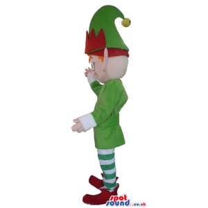 Elf with ginger hear and pointy ears wearing a green jacket