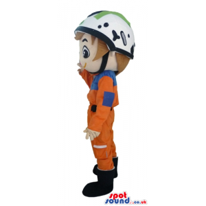 Racer wearing an orange suit, black boots, and a white helmet -