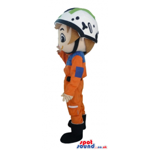 Racer wearing an orange suit, black boots, and a white helmet -