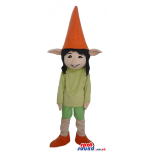 Elf with long black hair wearing a green shirt and shorts and a