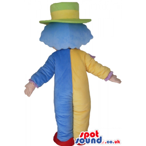 Clown with light-blue hair wearing a green and yellow hat, a