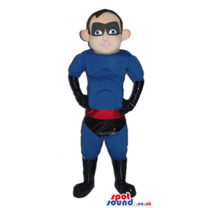 Muscleous super hero dressed in a blue suit, black trunks