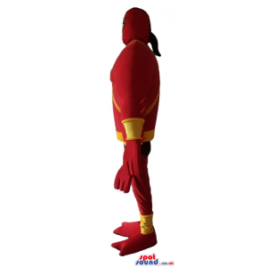 Muscleous super heroe with four arms wearing a red and yellow