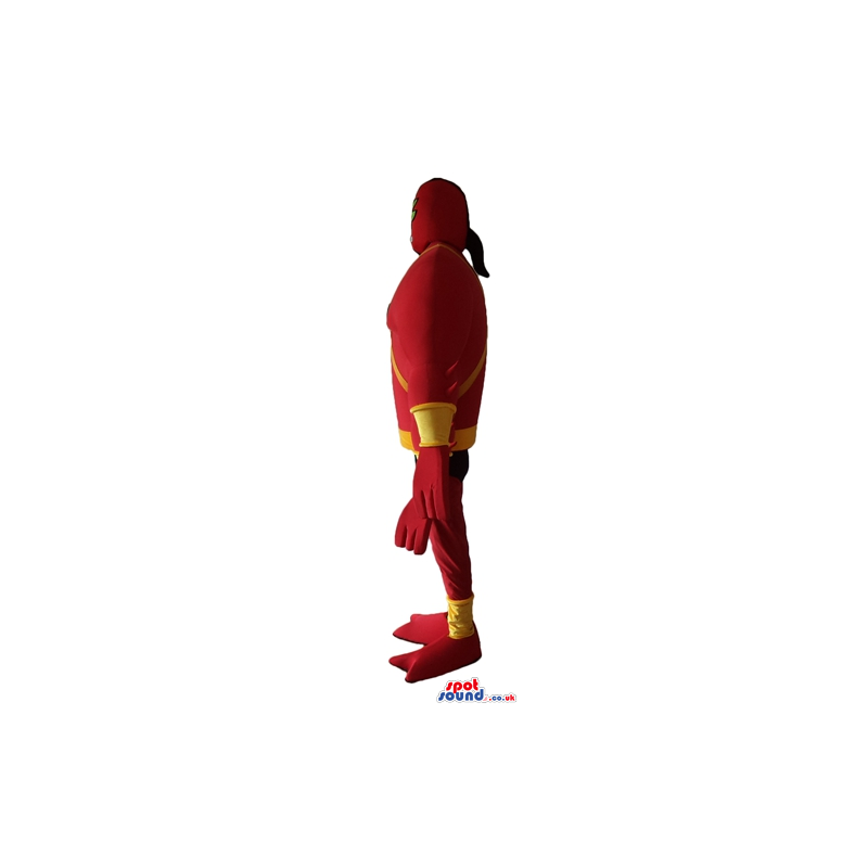Muscleous super heroe with four arms wearing a red and yellow