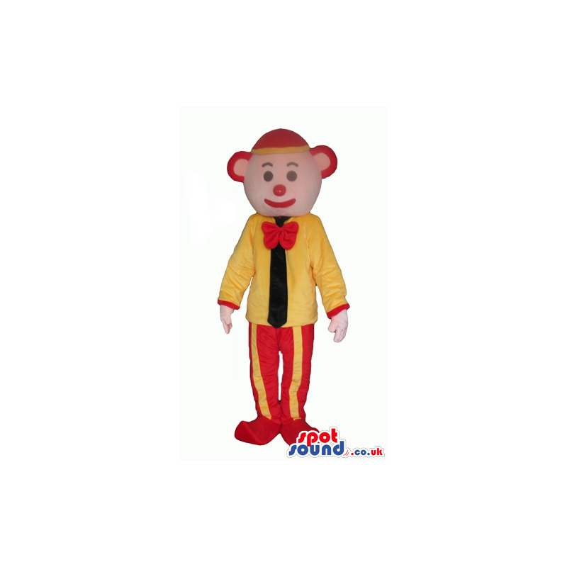 Clown with a red nose wearing a red and yellow cap, red and