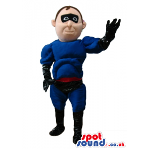 Muscleous super hero dressed in a blue suit, black trunks