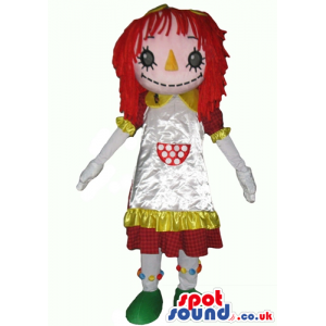 Mascot costume of a doll with big eyes and an orange nose, long