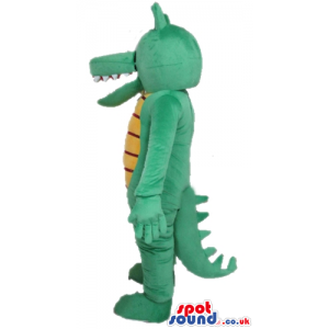 Green crocodile with big eyes and a striped yellow and black