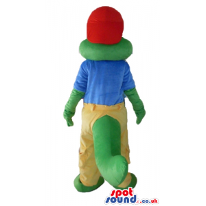 Crocodile wearing a red cap, a blue t-shirt and yellow trousers