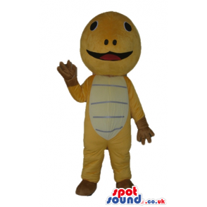 Beige turtle with small eyes and a big mouth with brown feet