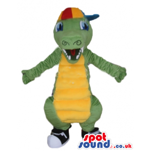 Green alligator with a yellow belly wearing black trainers and