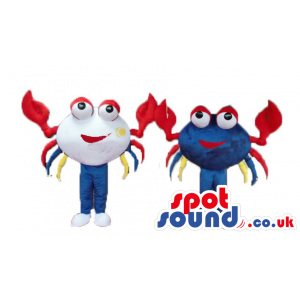 White crab with big eyes blue legs, white feet, red pincers and