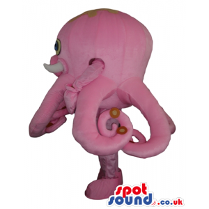 Big pink octopus with yellow and blue eyes and a round mouth -