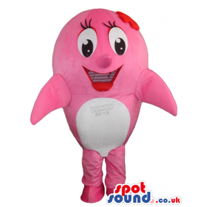 Fat pink whale with big round eyes, a big mouth and a red bow -