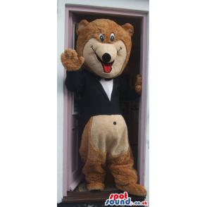 Brown teddy bear mascot thinking putting his hand in his mouth