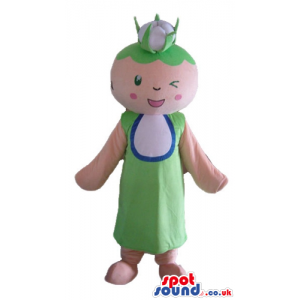 Pink girl with green hair and small eyes wearing a green dress