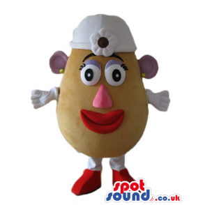 Mrs potato head with a big pink nose, purple ears and eyelids a