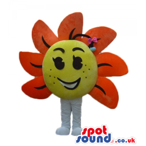 Big smiling flower with orange petals and a yellow center -
