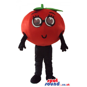 Red tomato with big round eyes, black arms and black legs -