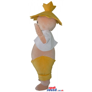 Fat smiling boy showing its belly wearing a yellow hat and