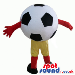 Soccer ball wearing yellow trousers, red socks, black trainers