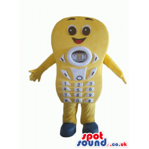 Smiling yellow telephone with white number keys, brown eyes and