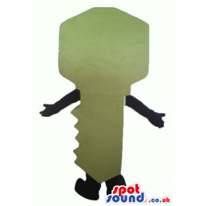 Green key with small round eyes, a big smile, black arms and