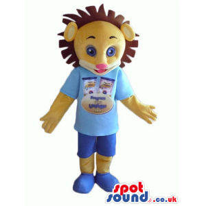 Beige lion with wearing a light blue t-shirt with a logo, blue