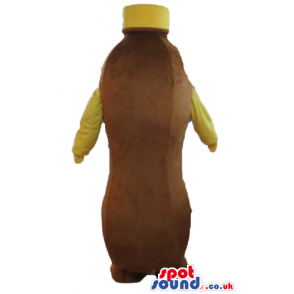 Brown bottle with brown feet, yellow cap and yellow arms -