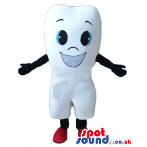 Smiling white tooth with black arms and legs and red shoes -