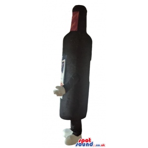 Black bottle of wine with a beige label and a yellow cap -