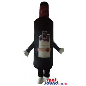 Black bottle of wine with a beige label and a yellow cap -