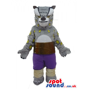 Grey hyena with yellow spots wearing violet shorts and a brown