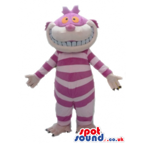 Striped pink cat with big orange eyes and sharp white teeth -