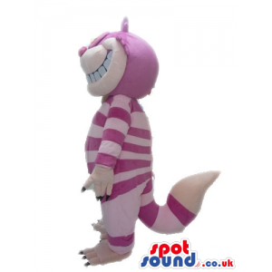 Striped pink cat with big orange eyes and sharp white teeth -