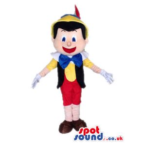 Pinnochio wearing red trousers, a yellow shirt, a black vest, a