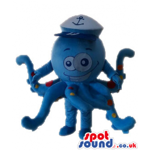 Blue octopus with red and yellow spots wearing a white sailor