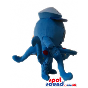 Blue octopus with red and yellow spots wearing a white sailor