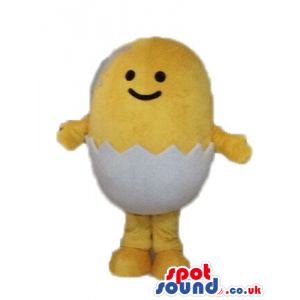 Yellow chicken with small black eyes and a huge smile hatching