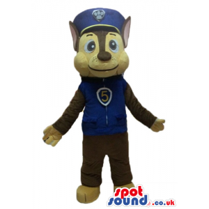 Brown wolf wearing a sporty blue jacket with a 5 on the chest