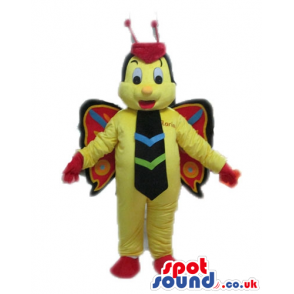 Yellow butterfly with red hands and shoes wearing a brown